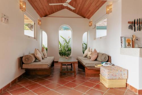 a living room with two couches and a ceiling fan at 3 Bed Private Villa With Pool, 250m To The Beach in Ahangama