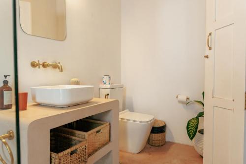 a bathroom with a sink and a toilet at 3 Bed Private Villa With Pool, 250m To The Beach in Ahangama