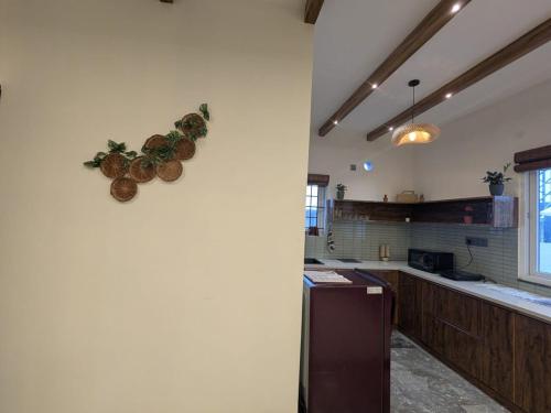 a kitchen with two baskets on the wall at Poolside Farm Retreat wit Garden in Hosūr