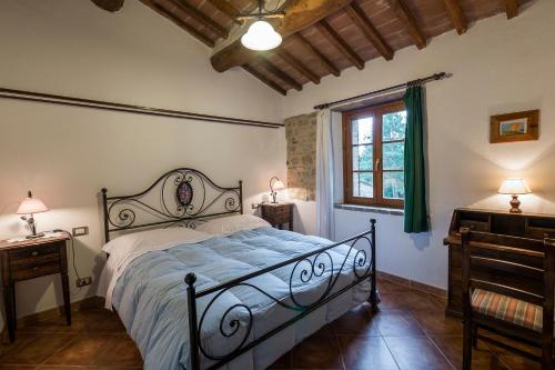 Postel nebo postele na pokoji v ubytování Agriturismo Monte Acuto