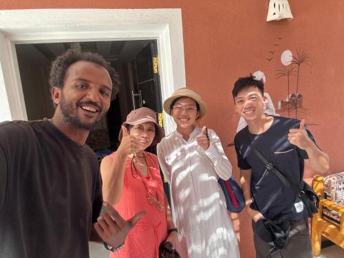 a group of people giving the thumbs up sign at Karma Kono in Abu Simbel