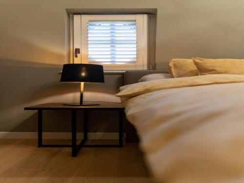 Ein Bett oder Betten in einem Zimmer der Unterkunft Beautiful holiday home in Vlaanderen with shared pool