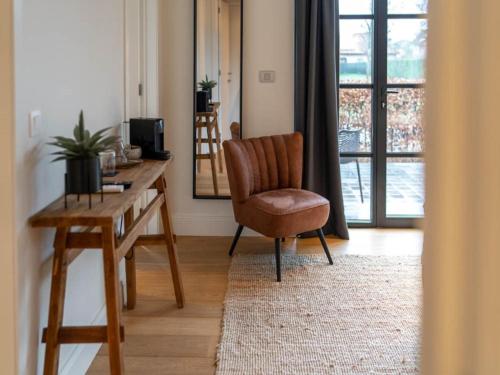Ein Sitzbereich in der Unterkunft Beautiful holiday home in Vlaanderen with shared pool