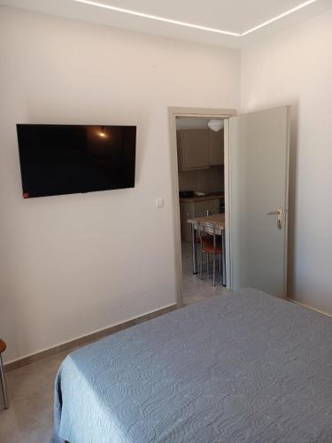 Ένα ή περισσότερα κρεβάτια σε δωμάτιο στο anastasakos villas DIAS