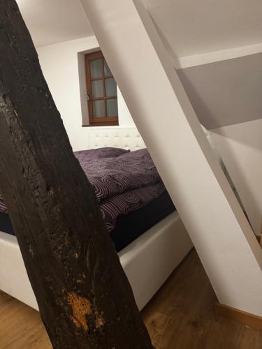 a small bedroom with a bed in the attic at Cozy one-room apartment in Nürnberg
