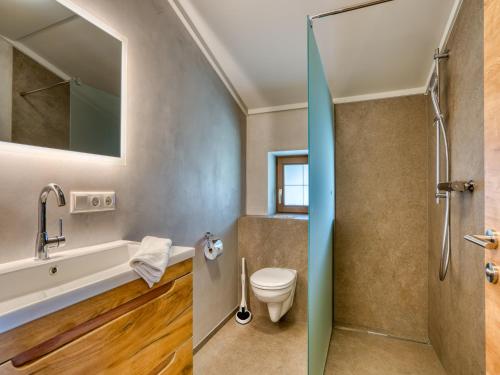 a bathroom with a sink toilet and a shower at Apartment building Ferien, Neukirchen in Rosenthal
