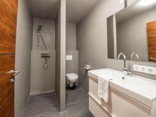a bathroom with a sink and a toilet at Apartment building Ferien, Neukirchen in Rosenthal
