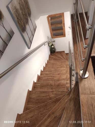 a staircase in a house with wooden floors at Ferienhaus Familie Zimmermann in Keutschach am See