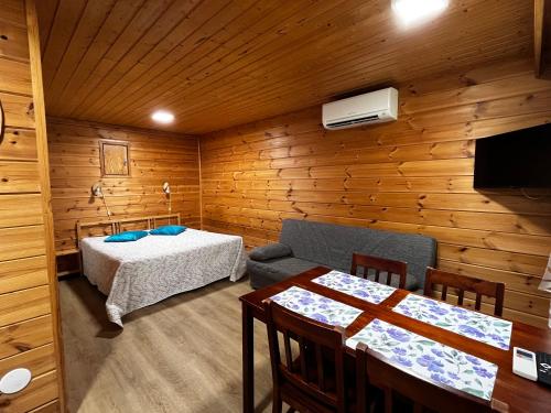 a room with a bed and a table in it at Motelli Rovaniemi in Rovaniemi