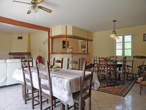 a dining room with a table and chairs at Apartment in France near Scenic Landmarks in Estang