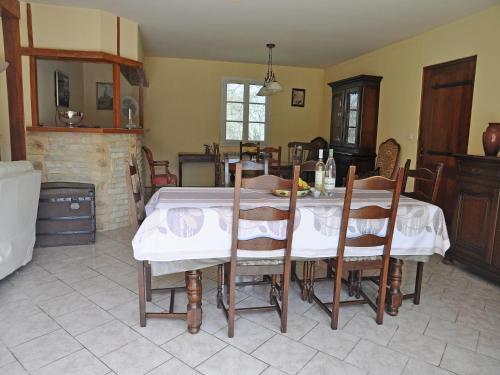 a dining room with a table and some chairs at Apartment in France near Scenic Landmarks in Estang