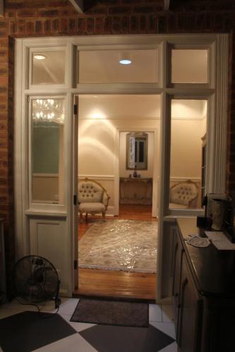an open door to a room with a living room at Le Residence de Josephine in Kloof