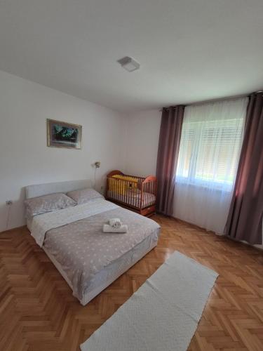 Ένα ή περισσότερα κρεβάτια σε δωμάτιο στο Apartman Sunce