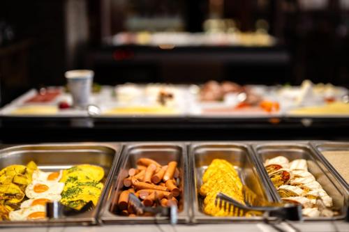 a tray of food with different types of food at Parkhotel Hohnstein by STEIGER Hotels in Hohnstein
