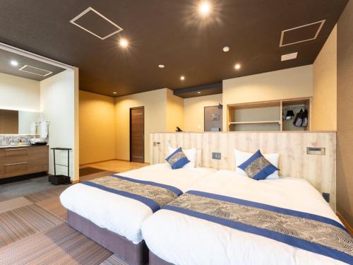 Katil atau katil-katil dalam bilik di Livemax Resort Sanuki Shionoe Onsen