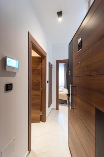 a hallway with a door leading to a bedroom at Crystal Luxury Apartments in Vrdnik