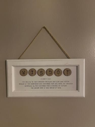 a picture of a sign hanging on a wall at Cosy apartment in heart of Cork City in Cork