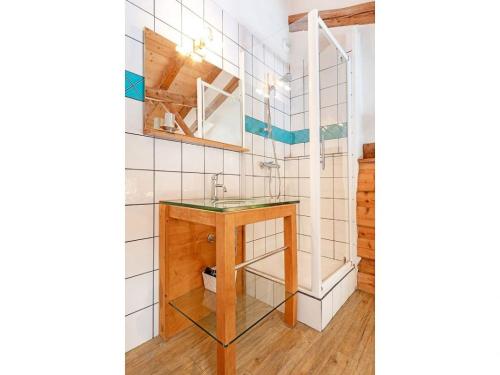a bathroom with a sink and a mirror at Chalet in Peisey near Ski Lift in Peisey-Nancroix