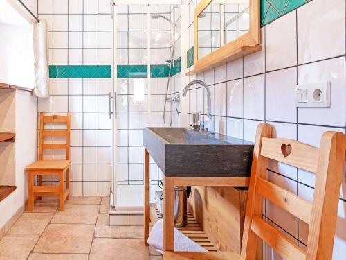 a small kitchen with a sink and a shower at Chalet in Peisey near Ski Lift in Peisey-Nancroix