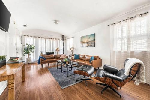 a living room with a couch and chairs at Spacious 4 bedroom home by Melrose and 10 minutes to Hollywood Walk of Fame in Los Angeles