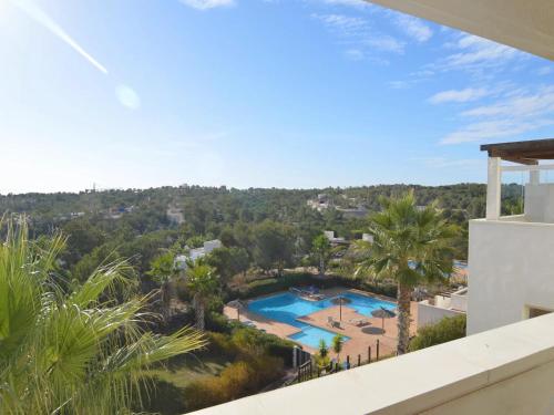 a view of a swimming pool from the balcony of a house at Golfside Luxury at Las Colinas in Orihuela Costa