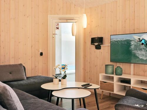 a living room with a couch and a table at Luxury Retreat with Pool - By Traum Ferienwohnungen in Vejby