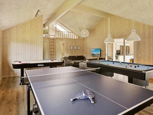 a room with two ping pong tables and snooker at Luxury Retreat with Pool - By Traum Ferienwohnungen in Vejby