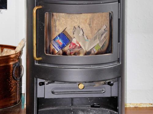 a stove with a tv on top of it at 9 person holiday home in Lyngseidet in Lyngseidet