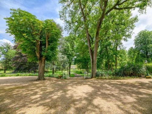 a park with two trees in a park at Holiday Home in Puygareau near Poitiers in Savigny-sous-Faye