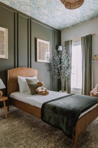 a bedroom with a bed with a teddy bear on it at have fun staying here in Kuala Lumpur