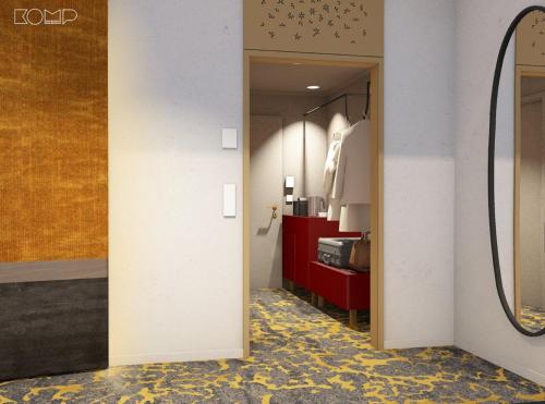 a corridor of a hotel room with a mirror at Hotel Lycium Debrecen - Handwritten Collection (October 2025) in Debrecen
