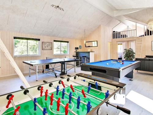 a large room with two tables and a pool table at 5 star holiday home in Nexø in Bedegård