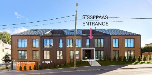 a building with a street sign in front of it at Lootuse 2a in Tartu