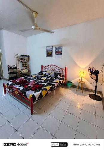 a bedroom with a bed in a room at Homestay D'Lapang near KLIA in Sepang