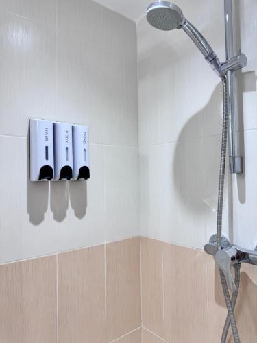 a bathroom with a shower with a shower head at La Cachette d'Antibes in Antibes