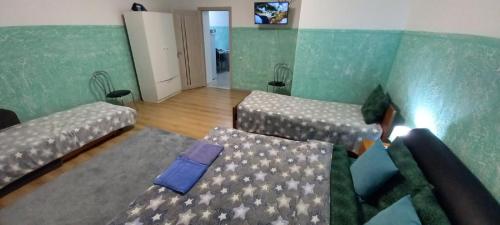 a living room with two couches and a couch at Апартаменти в гостьовому будинку in Mukacheve