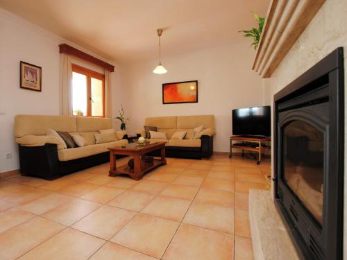 a living room with a couch and a television at Villa in Mallorca with Private Pool in Marratxi