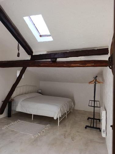 a bedroom with a bed in a attic at La Casona de Alan-Brú in Boceguillas