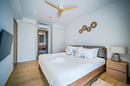 Ένα ή περισσότερα κρεβάτια σε δωμάτιο στο Beachside 1 BR apartment by NLA