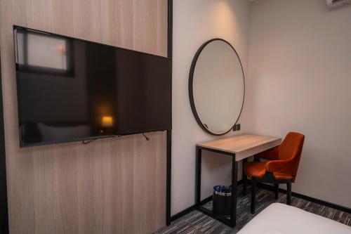Televisyen dan/atau pusat hiburan di Manazel Aldiafah serviced Apartments AlSulymaniyah