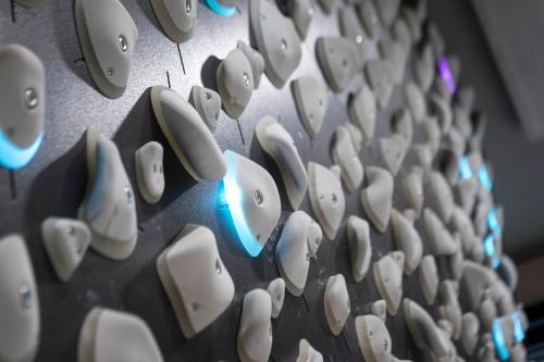 a row of white speakers on a wall at Neueröffnung ELVA PREMIUM APARTMENT HOTEL inklusive Sommerpass STUBAI SUPER CARD in Neustift im Stubaital