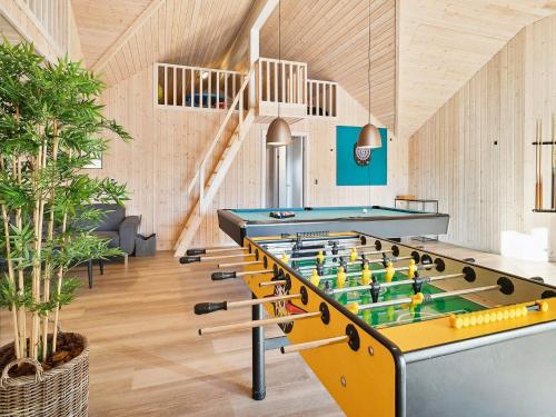 a room with a billiard table and a staircase at Luxury Pool Retreat by Sea - By Traum Ferienwohnungen in Harboør