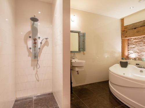 a bathroom with a toilet and a sink at Waterfront Stelp Farmhouse with Sauna in Molkwerum