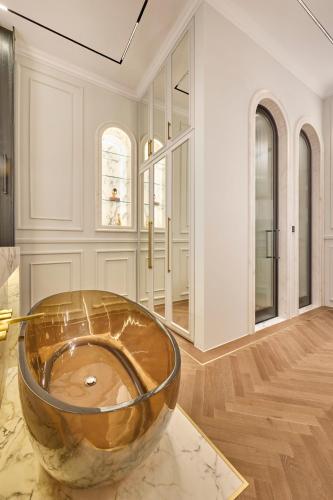 a large bowl sitting on top of a table in a room at Ermou 99 Intelligent Private Suites in Athens