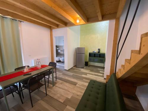 a kitchen and dining room with a table and chairs at Dimora Filippo in SantʼElpidio a Mare