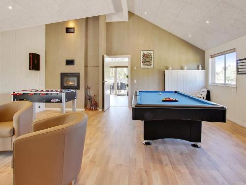 a living room with a pool table and ping pong ball at Luxury Retreat in Blavand - By Traum Ferienwohnungen in Blåvand