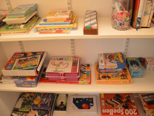 a book shelf filled with lots of books at Farmhouse in Haarlo near Lake Hambroek in Haarlo