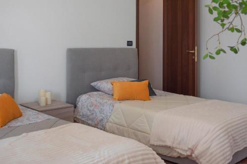 Ένα ή περισσότερα κρεβάτια σε δωμάτιο στο Casa Vacanza Tra Vigneti E Mura