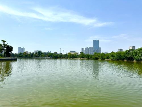 a large body of water with a city in the background at Delux Apt Studio Near Marriott And Keangnam In City Centre in Kon Rung (1)