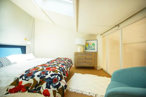 Ένα ή περισσότερα κρεβάτια σε δωμάτιο στο La Maison de L'Île de Ré - Proche du Port